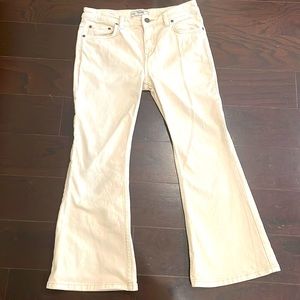 free people  waist line 15" across. 34" top to bottom. Flare bottom 10"wide